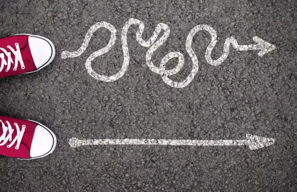 an image of two arrows one is a scribbled way and one is a straight pointing the right way